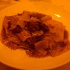 Tacconi cinghiale (wide flat pasta with boar).