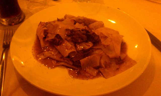 Tacconi cinghiale (wide flat pasta with boar).