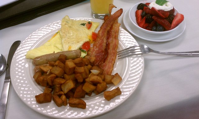 Spinach, tomato, feta omelettes; home fries, bacon (yay), pork sausage.