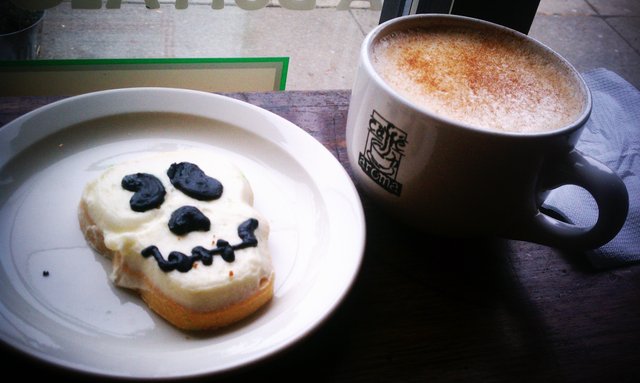 Hot chai cider, skull cookie, "Ghostbusters" in the background.