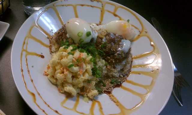 Loco moco: burger patties over white rice, with country gravy, poached eggs, mac salad.