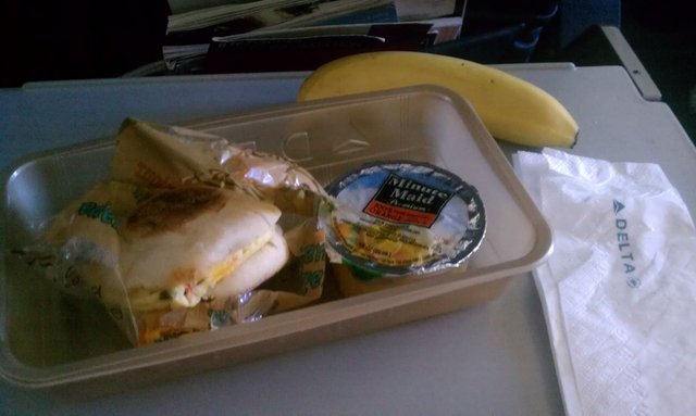 Breakfast on the flight: egg muffin, juice, banana. The steward gave me two of these after my double dinner.