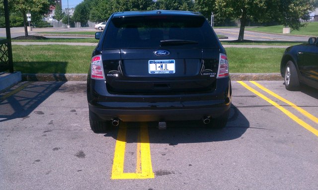 Ford Edge, vanity plate 1 MJL, taking two spaces. Scratch-free.