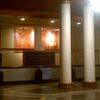 Lobby. The wood inlay wall behind the desk is a scene of #Buffalo.