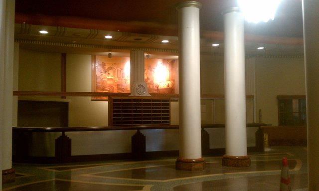 Lobby. The wood inlay wall behind the desk is a scene of #Buffalo.