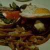 Grass-fed angus, house-made bacon, fried duck egg, buttermilk blue cheese burger. Truffle oil fries.