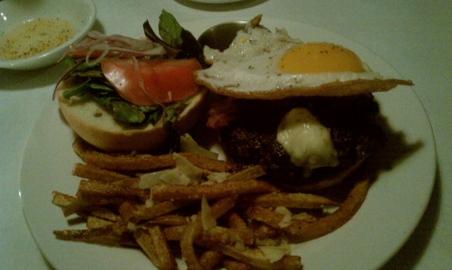 Grass-fed angus, house-made bacon, fried duck egg, buttermilk blue cheese burger. Truffle oil fries.