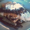 Giant French toast with Grand Marnier whipped cream, pecans, berries. Bacon & sausage.