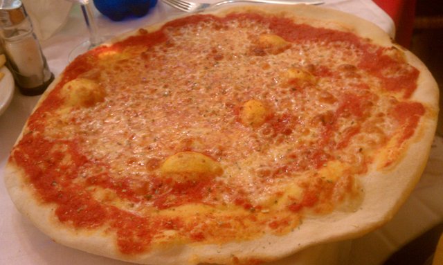 Margherita pizza. Moved inside when the downpour blew the canopies back.