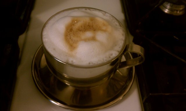 Trying a homemade cappuccino using stove-top espresso maker and saucepan for milk.