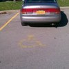 FGJ 6165 Saturn. Parked in handicap spot, no handicap tag or plate.