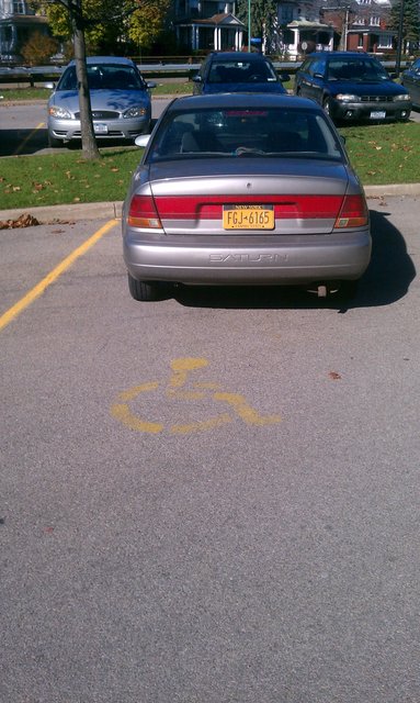 FGJ 6165 Saturn. Parked in handicap spot, no handicap tag or plate.