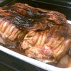 The bacon-wrapped pork shoulder is almost ready.