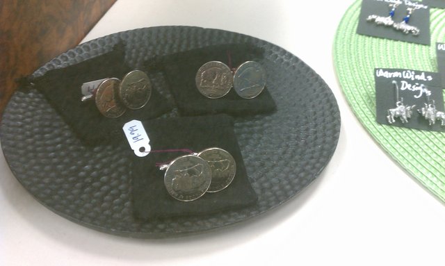 Two sizes of Buffalo nickel cuff links. Mine were made from real coins by a local artist, though.