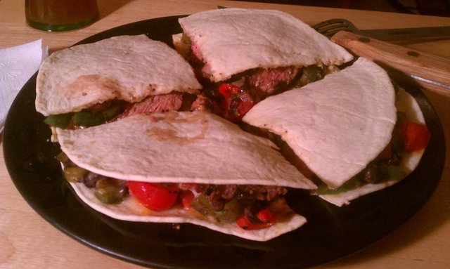 Quesadillas filled with strip steak. Now for my fourth time washing dishes today.