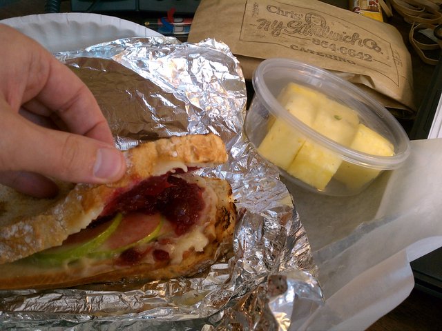 Turkey, apple, cranberry, brie sandwich with side of pineapple from Chris' Sandwich Co.