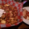 Bistro tater tots. I had them add bacon. I wasted (befouled) a pig.