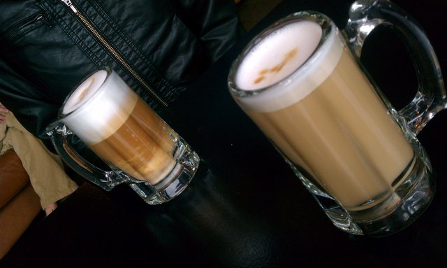 Her cappuccino has a Guinnees cascade. Now I want a stout.