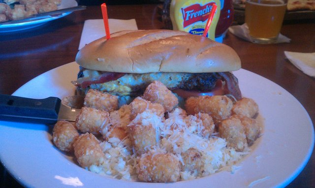 Bacon, cheddar, fried egg burger (not on menu); garlic, parmesan tots.