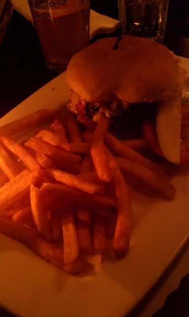 Pepper-crusted burger with bleu cheese and roasted red peppers.