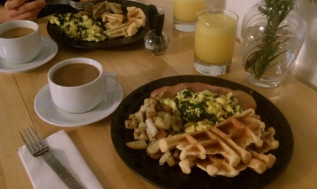 New Year's Day breakfast: mimosa, latte, ham, home fries, spinach asiago eggs, Belgian waffles.