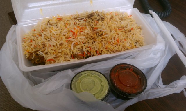 Chicken biryani (takeaway): basmati rice and chicken masala.