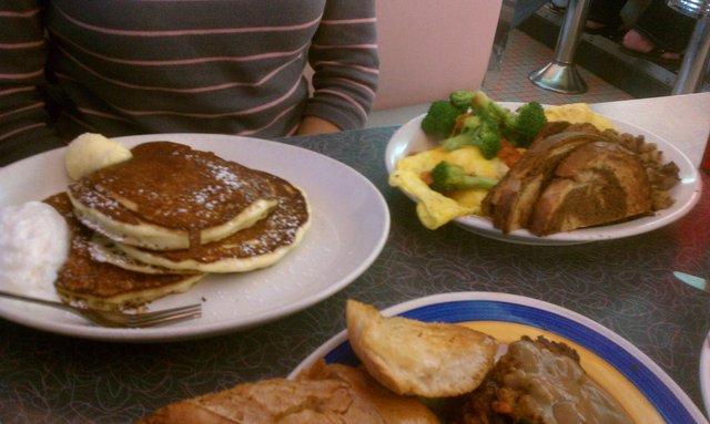 Short stack of pancakes, broccoli tomato cheese 3 egg omelette, home fries, rye.