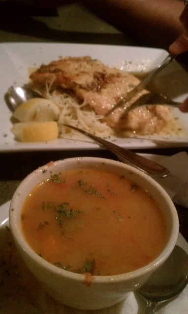 Pasta e fagioli, with a portion of chicken francese in the background.