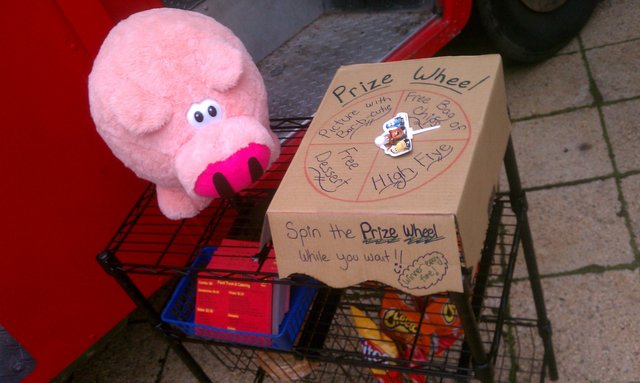 Bar-b-Cutie and the prize wheel at @RnRBBQTruck (I won Fritos).