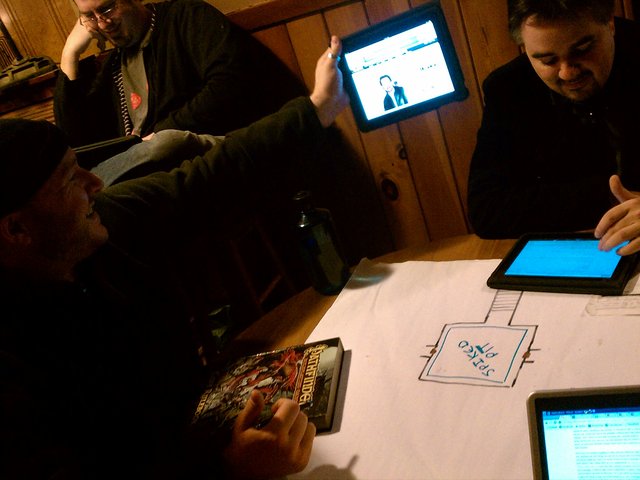 5 guys (inc a Joe Mantegna look-alike), 4 iPads and 1 netbook. I'm the one kicking it old-school.