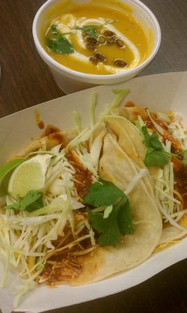 2 beef tacos and butternut squash soup with candies pumpkin seeds & Mexican crema.