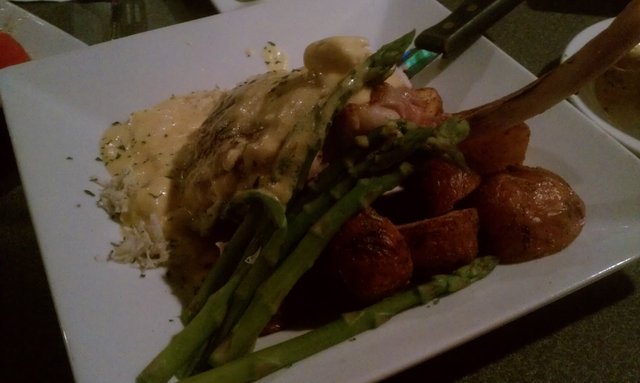 Veal oscar: 16oz seared veal chop, crab meat, asparagus, bernaise sauce, roasted potatoes.