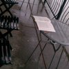 Lonely book and cigar on rainy patio (not quite as classy as it sounds).