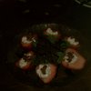Strawberries stuffed with goat cheese, pancetta, drizzled with balsamic.