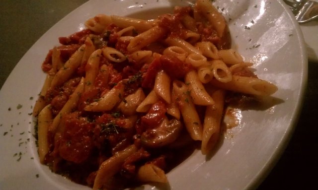 Custom dish: penne, cream pomodoro, mushrooms, sauteed onions, sundried tomatoes, romano cheese.