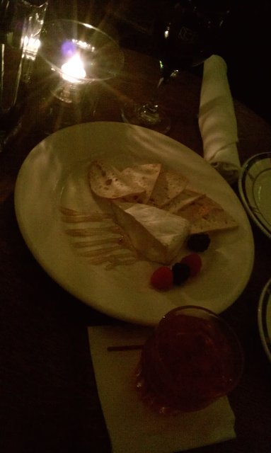 Brie, crostini, honey, berries; campari on the rocks (in the Craftsman Lounge).