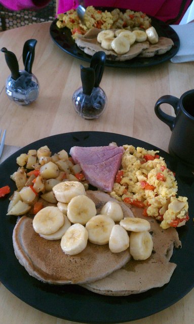 Chocolate chip pancakes, banana maple syrup; red pepper, onion, cheddar eggs; red pepper home fries; ham; espresso.