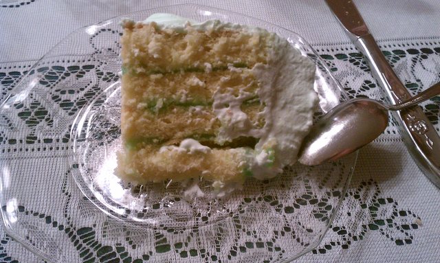 Pistachio jelly roll upturned and made into a cake. A green cake.