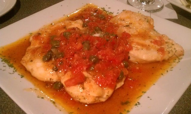 Chicken ala Amici: cutlets sauteed with tomatoes, capers, onions, garlic, herbs, wine.