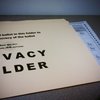 Privacy folder, "to maintain secrecy of ballot," even though ballot is wider than folder.