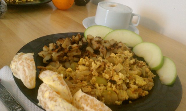 Apple, onion, cheddar, rosemary, eggs; rosemary homefries; cappuccino; fruit bits.