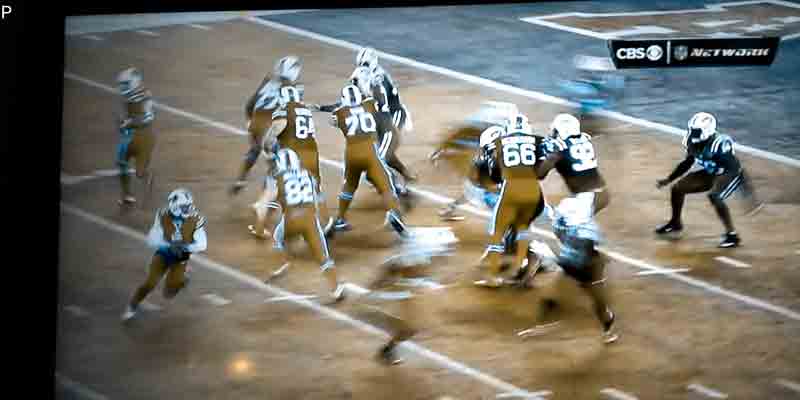 Bills/Jets game, red & green uniforms as seen with colorblindness, start of a play.