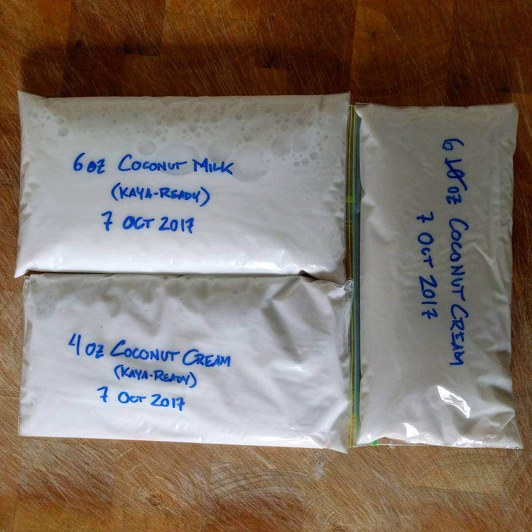 Three resealable bags, each labeled with marker. One is six ounces of coconut milk, one is four ounces of coconut cream, one is six ounces of coconut cream. The first two are also marked as ready for kaya.