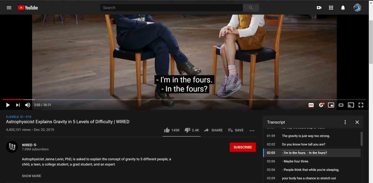 The YouTube player with two people talking, their heads clipped by the top of the window so it is not possible to see who is speaking; the captions and transcript signify differing speakers with a leading dash, but no names.