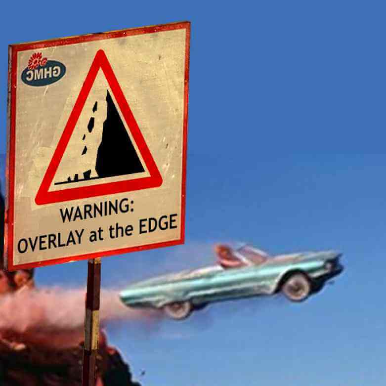 A road sign with a cliff icon and the text “WARNING: OVERLAY at the EDGE;” in the background a convertible blue Cadillac is airborne from a cliff edge.