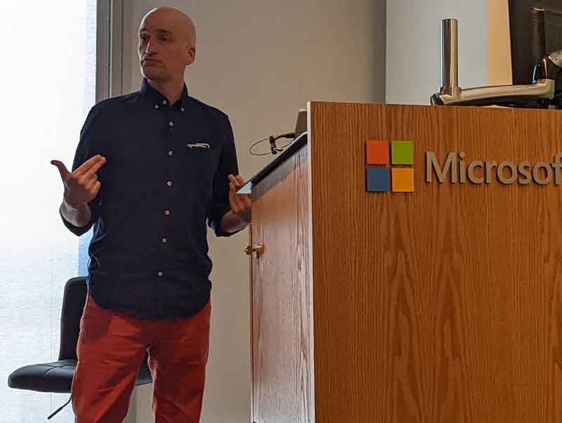 Adrian Roselli behind Microsoft lectern