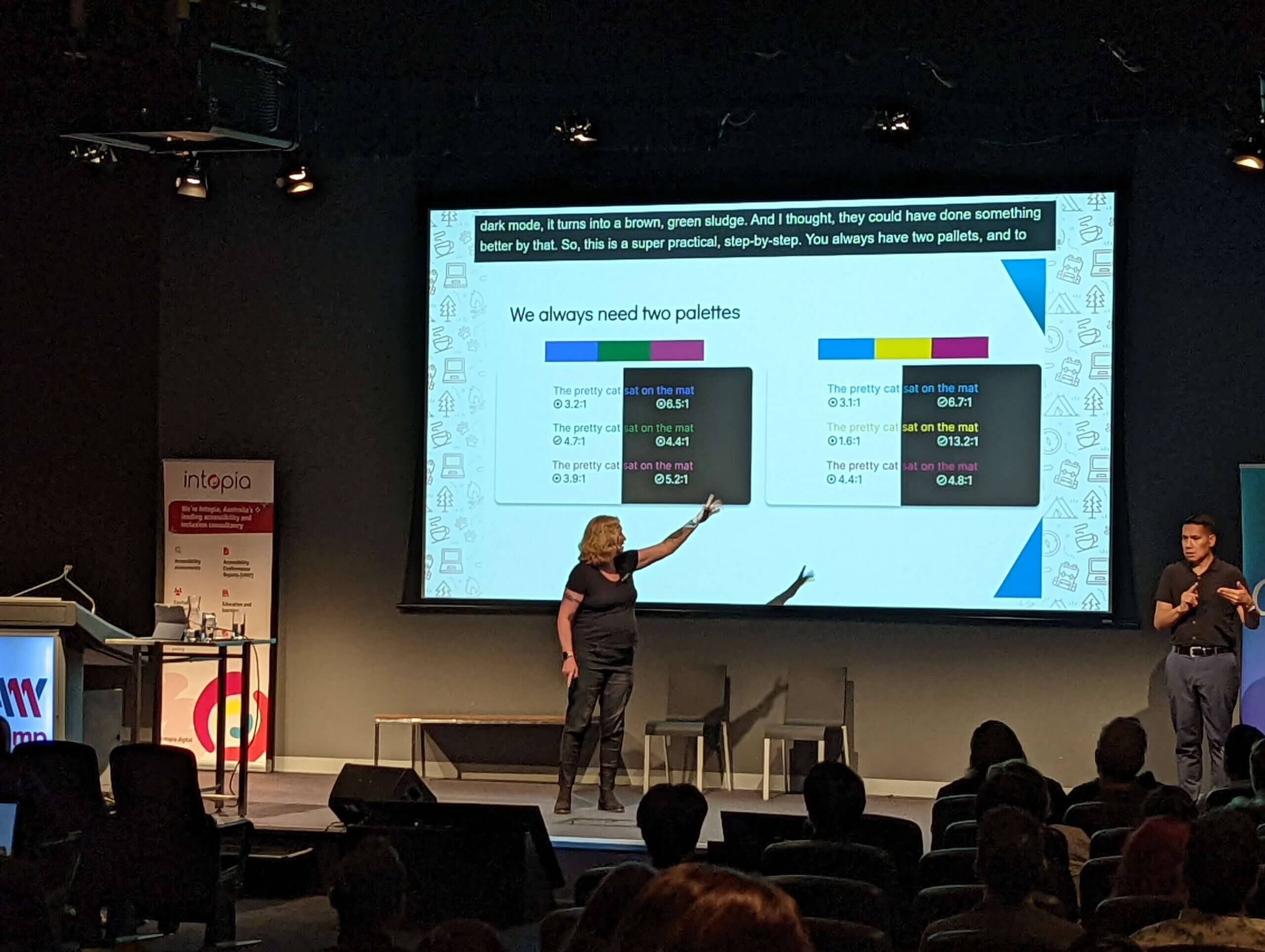 A slide titled “We always need two palettes” that shows a pair of three-color palettes. The first (blue, green, magenta) passes WCAG checks on white but fails on black. The second (blue, yellow, maroon) fails against white but passes on black.